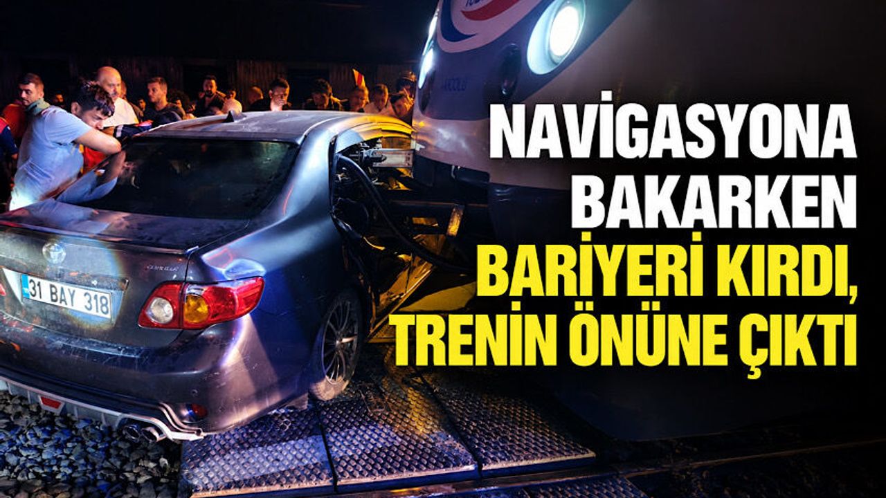 Navigasyona bakarken bariyeri kırdı, trenin önüne çıktı