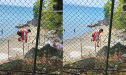 Ücretli hale getirilen plaja tel örgüleri aşarak girmeye çalıştılar