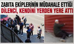 Zabıta ekiplerinin müdahale ettiği dilenci, kendini yerden yere attı