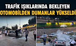 Trafik ışıklarında bekleyen otomobilden dumanlar yükseldi