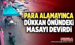 Para alamayınca dükkan önündeki masayı devirdi