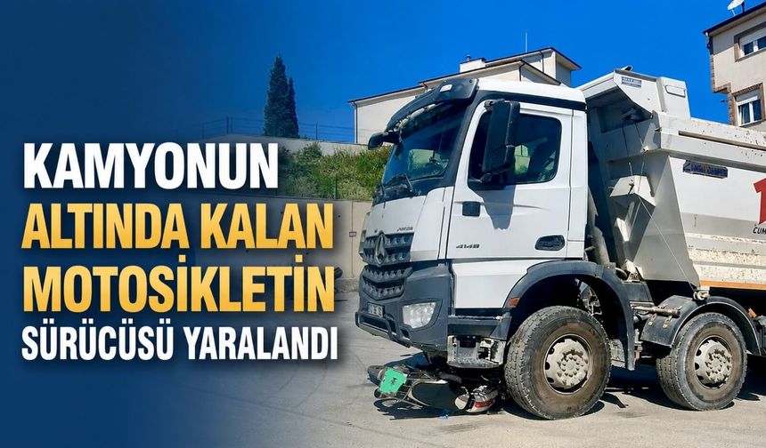 Kamyonun altında kalan motosikletin sürücüsü yaralandı
