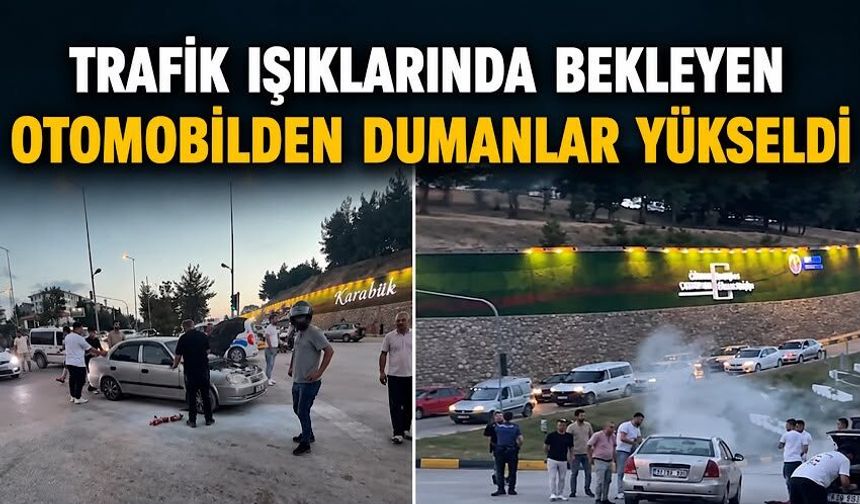 Trafik ışıklarında bekleyen otomobilden dumanlar yükseldi