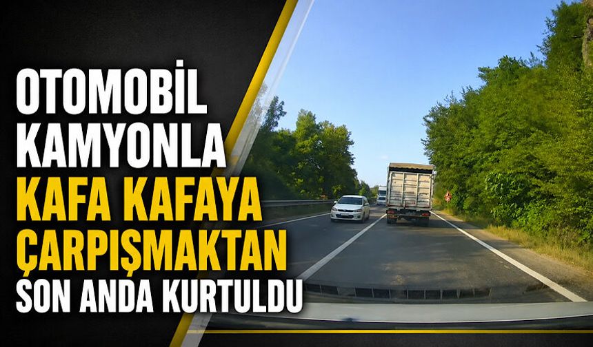 Otomobil kamyonla kafa kafaya çarpışmaktan son anda kurtuldu